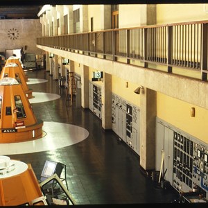 Interior view shows orange exciters and grey control panels