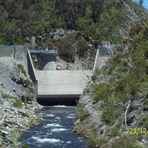 Downstream face with ungated spillway and flip bucket