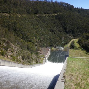 Concrete spillway chute leading to plunge pool