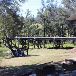 The rest stop is located on the bank of a creek