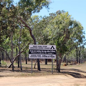 Warning sign and the road north.