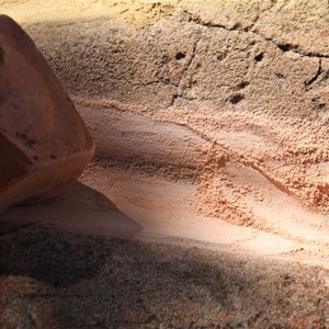 Grinding pink ochre at Xmas Pool