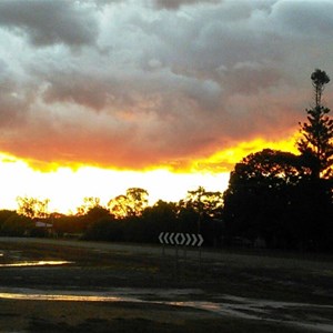 The setting sun lights departing storm clouds