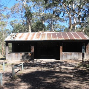 Weather shelter with fire place and tables