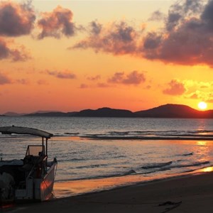 The sun rising over Cape York from Punsand Bay